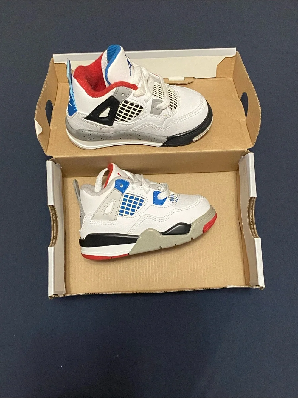 Nike Kids' White Sneakers with Red & Blue Accents